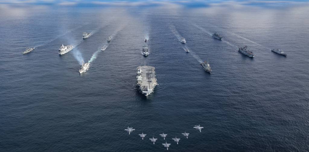 UK CARRIER TASK GROUP MEETS WITH NATO AMPHIBIOUS TASK GROUP

Pictured: HMS Prince of Wales leads the fifteen ship formation as jets fly past.

The UK-led Carrier Strike Group amalgamates with the NATO Amphibious Task Group and additional Norwegian naval units for a PHOTEX 13 Mar 24. Aircraft participating in the flypast were six Finnish F18 and two Swedish JAS-39. Fifteen ships sailed in formation as follows:

Front row: HMS Prince of Wales
Row 2 (L-R): USS Paul Ignatius, ESPS Almirante Juan de Borbon, 
Row 3 (L-R): HMS Portland, HNLMS Karel Doorman, HNOMS Magnus Lagabote, RFA Tidespring, HNOMS Olav Tyrggvason, ITS Giuseppe Garibaldi, FS Normandie
Row 4 (L-R): RFA Mounts Bay, HNOMS Otto Sverdrup, HNOMS Gnist, Kv Bjornoya, FGS Bonn


The units are at sea for Exercise Nordic Response 24, a multi-domain exercise taking place in the northern Nordic region 3–14 March 2024. The CSG has been exercising F-35B strikes to simulate defence of allied territory, whilst simultaneously defending itself. The ATG has been exercising landing amphibious units ashore to retake allied territory. Exercise Nordic Response 24 is part of Exercise Steadfast Defender 24, the largest NATO exercise in decades. 

