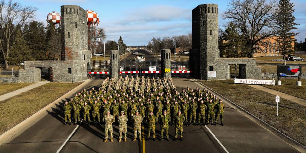 Troops from the Minnesota National Guard and the Norwegian Home Guard and Youth stand together in an opening ceremony to the 51st Norwegian Reciprocal Troop Exchange (NOREX) at Camp Ripley Training Center in Little Falls, Minnesota on February 2nd, 2024. NOREX is an annual training event where Soldiers and Airmen from both forces fly overseas to their allied country and conduct winter survival and cold-weather operation training with each other (Minnesota Army National Guard Photo by Sgt. Jorden Newbanks).