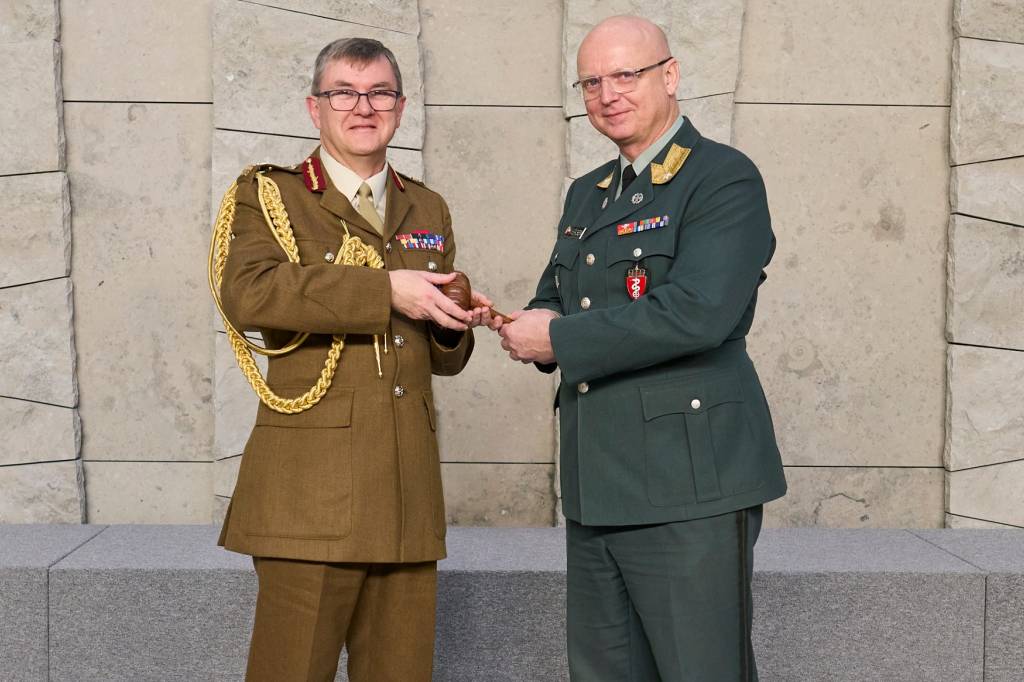 Major General Tim Hodgetts passing over the Chair of COMEDS position to Brigadier General Petter Iversen during the COMEDS 62nd Plenary Meeting