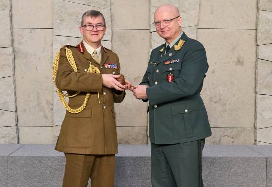 Major General Tim Hodgetts passing over the Chair of COMEDS position to Brigadier General Petter Iversen during the COMEDS 62nd Plenary Meeting